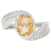 Elegant oval yellow citrine sterling silver ring with moissanite accents, perfect for sophisticated style.
